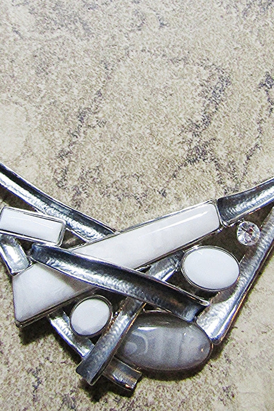 SILVER GREY METAL CRISS CROSS NECKLACE